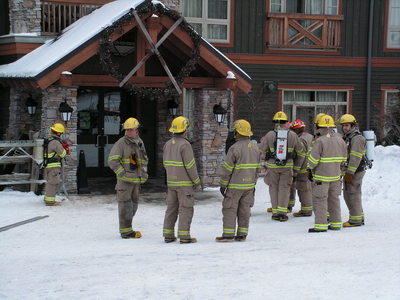 Waiting for all clear to start packing up the fire hoses and trucks.